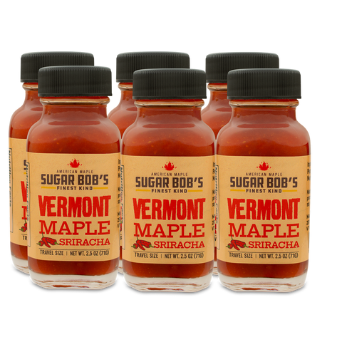 Bottles of Vermont Maple Sriracha on a white background
