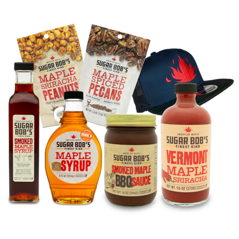 Collection of Sugar Bob's maple products including syrup, sauce, and snacks on a white background.