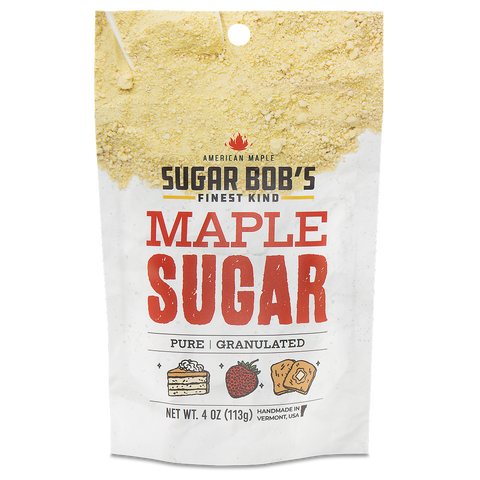 A package of Sugar Bob's finest kind maple sugar, showing a white label with the product name and an illustration of a maple leaf, a waffle, and a pancake with syrup.