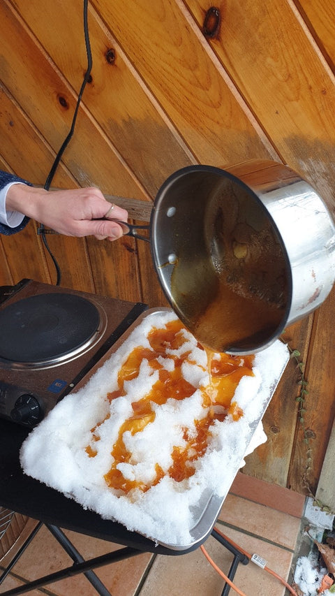 Traditional Vermont Sugar on Snow dessert made with fresh maple syrup poured over snow