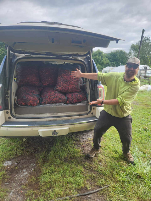 Truck loaded with bags of pepper by Sugar Bob's, supporting local businesses