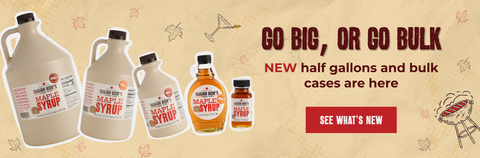 Advertisement for maple syrup products with text 'Go Big, or Go Bulk' on a beige background.