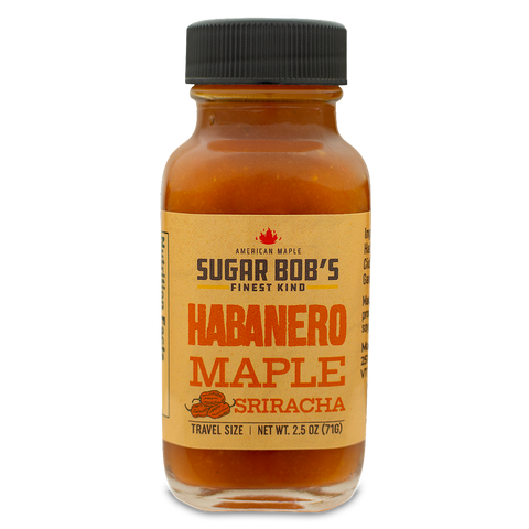 Bottle of habanero maple sriracha sauce with a label on a white background.