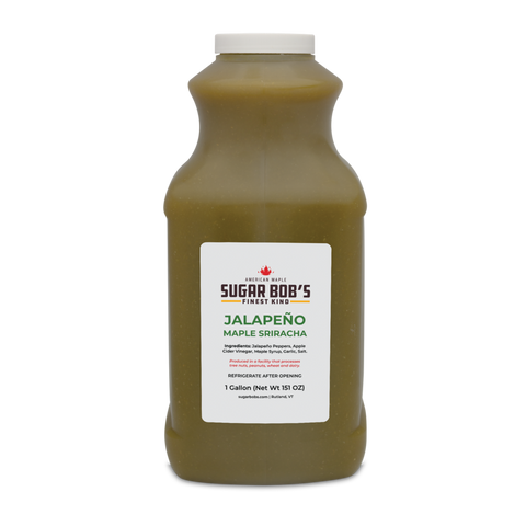 Bottle of jalapeño maple sriracha on a white background