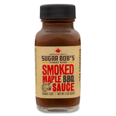 Bottle of smoked maple BBQ sauce with label on white background