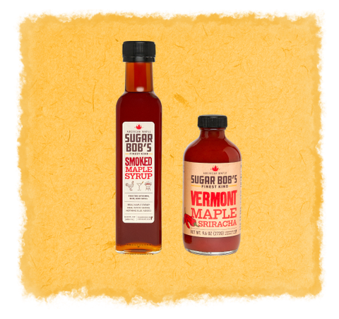 Two bottles of Sugar Bob's maple syrup products on a textured yellow background