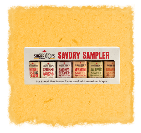 
Savory Sampler box with travel size sauces on a textured yellow background