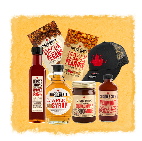Collection of Sugar Bob's maple syrup, snacks, and sauces as a gift set on a yellow textured background