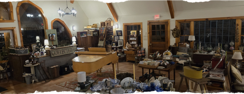 Interior of a store with various items on display, including furniture and decor.